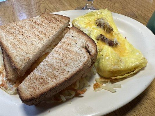 Sausage and cheese omelets with wheat toast and hash browns on the side! So yummy!