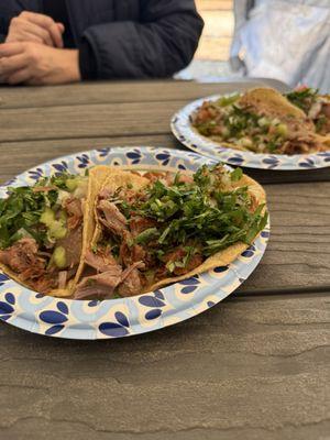 Mixto on the left, carne on the right. Tacos come undressed. There is a salsa bar with toppings in the tent.