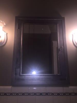1920's medicine cabinet stripped and restored to original metal. New mirror installed by Ogontz Glass and Mirror.