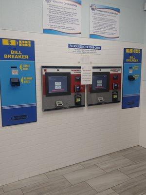 Card vending machine. You have to purchase a card to use washers & dryers. It accepts cash, debit & credit.