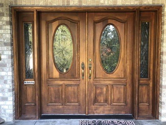 Old front entry before painting. Blotchy stain job makes the bottom of the door look sad.