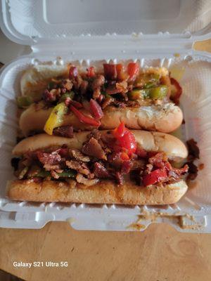 Hotdogs with pickled peppers and jaleponos. Bacon topped. VERY TASTEY