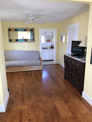 Queen futon and single futon in living room.