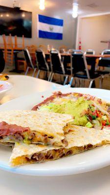 Quesadilla de asada with beans, rice, guac and poco de gallo