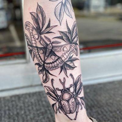 Black and grey bug tattoos done by Casey Dohner.