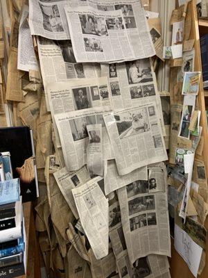 Newspaper articles all over the shop posted.