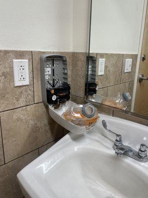 broken soap dispenser