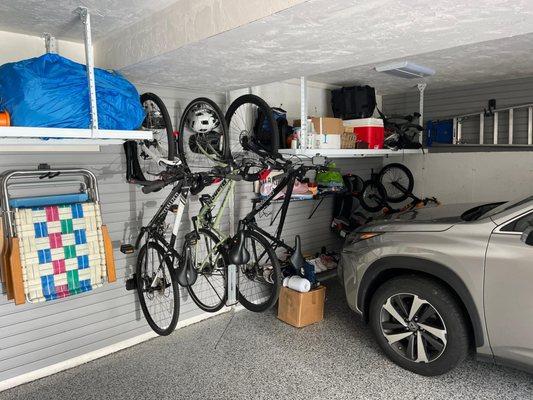 Overhead Storage Solutions and Slatwall Organization System with a new epoxy floor coating in the garage.