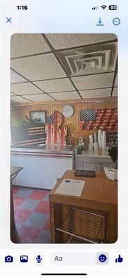 American flags behind the counter. This place is very patriotic love this place