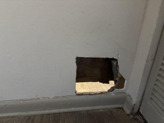 Hole in wall that the maintenance people left and never came to fix!