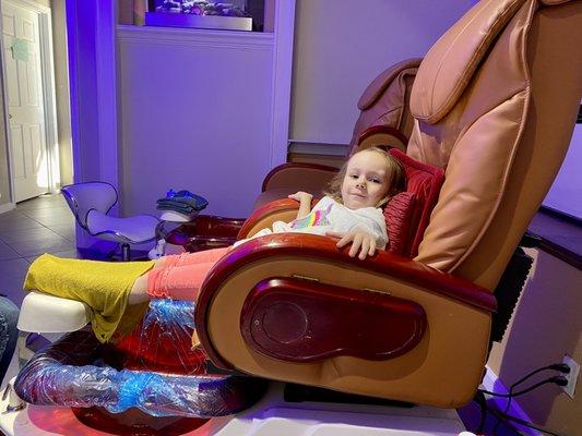 My daughter thoroughly enjoying her pedicure