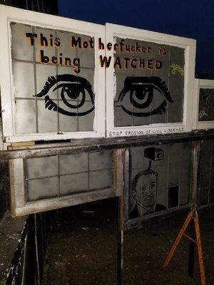 Some skinny dude wearing overalls, a ball cap and glasses was painting this during the show