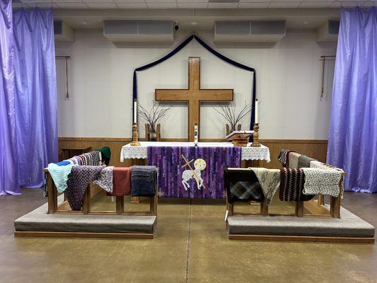 Prayer shawls made by members, blessed by the congregation, and donated to hospice programs