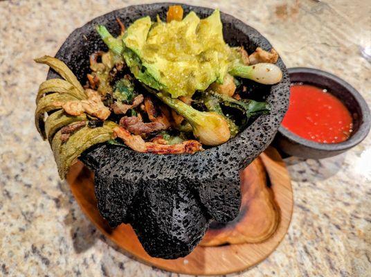 Molcajete It had nopales . This is pretty much fajitas. If you eat this you are going to be very full. It comes with a tortillas