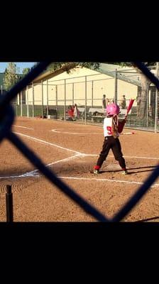 The niece playing t-ball
