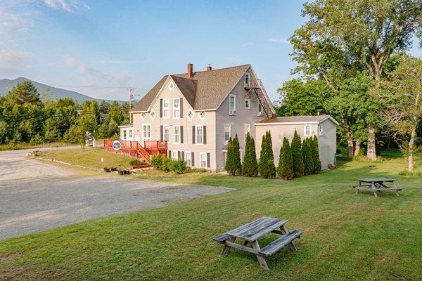 Spacious yard with ample free parking for cars and snowmobile or ATV trailers.