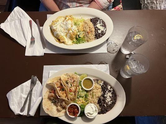 Enchilada with chicken and shrimp tacos served with black beans and rice