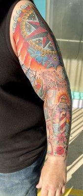 Forearm, lighthouse, astrological sign, rabbits foot, red ray ban memorial