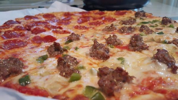 Best pizza ever! Half pepperoni and garlic. Half sausage, garlic, green pepper, and artichoke.