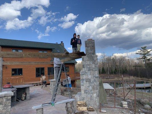 Outdoor Living Area with deck work on a pond
