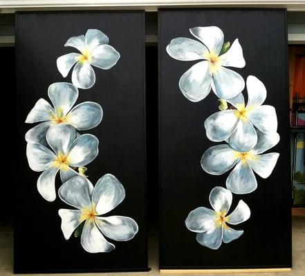 Plumeria murals by Cynthia Kostylo give the building an Aloha vibe.