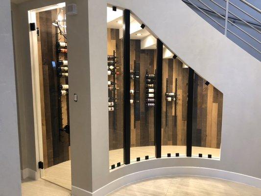 Wine rack underneath stars with glass door and fixed panels
