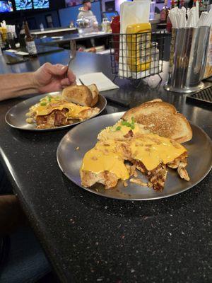 Burbon glazed chicken breasts topped with cheese bacon chives and crispy onions. Served with garlic mashed potatoes, Texas toast and salad.