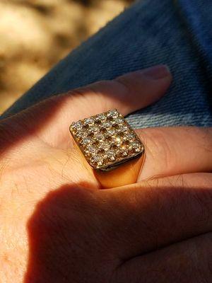 To the final finished bracelet ring it has over  1 ozt 14k yellow and white gold and a carat of diamomds