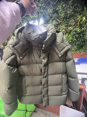 Professional down coat cleaning, finished and ready for pickup.