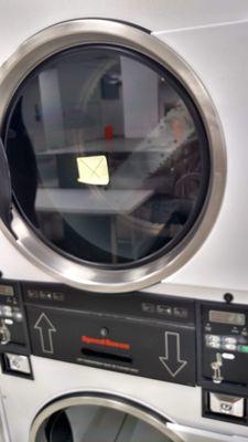 The sticky note with the "X" means the machine is Out Of Service!