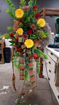 Round 22" inch wreath with moss, bells of island, bronze football mums, Red roses, yellow gerbers