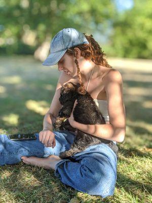 Luna, our mini bernedoodle with our daughter