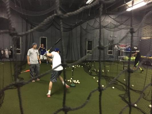 Hitting instructor giving hitting lessons at Premier Baseball Kansas City Baseball Facility