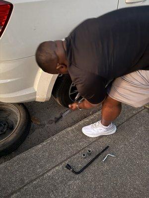 Cousin taking my tire off with standard equipment