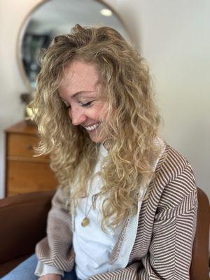 Beachy curly natural blonde highlights.