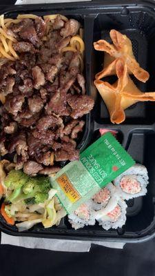 Bento box with beef, noodles, California rolls. Yummy