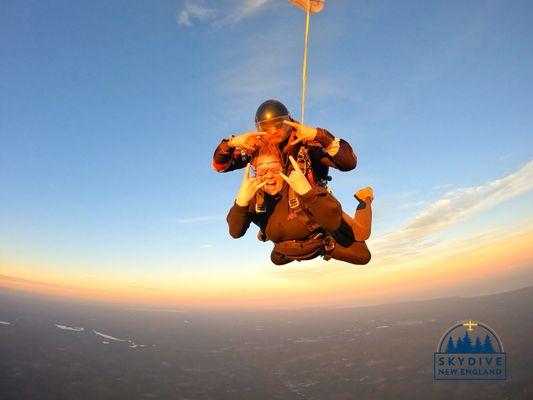 Tandem jump near sunset