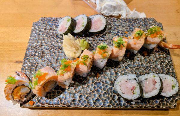 Seared salmon roll in the middle and a yellowtail roll