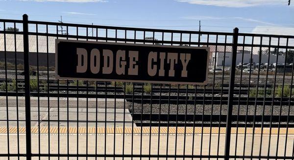 Tracks and city sign