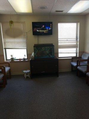 The waiting area, there is also some water bottles and toys for kids.