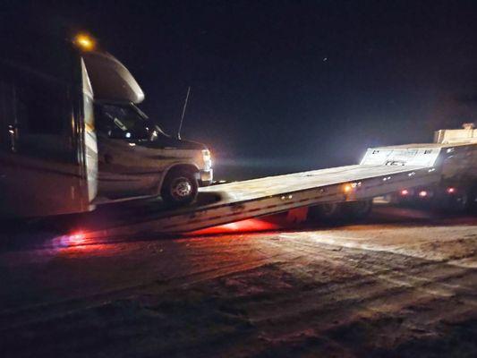 Jim loading my motorhome, Sweet Pea Too, on to the tow truck.