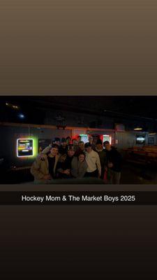 Owner, and UW Stout Men's Hockey Team celebrating the win!
