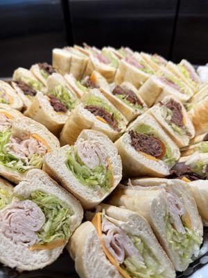 Turky and Roast beef Subs with Lettuce , tomato, cheese.