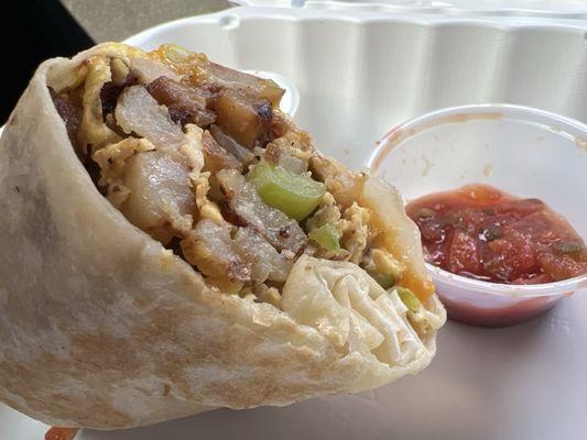 Breakfast burrito with peppers, onions, eggs and potatoes!