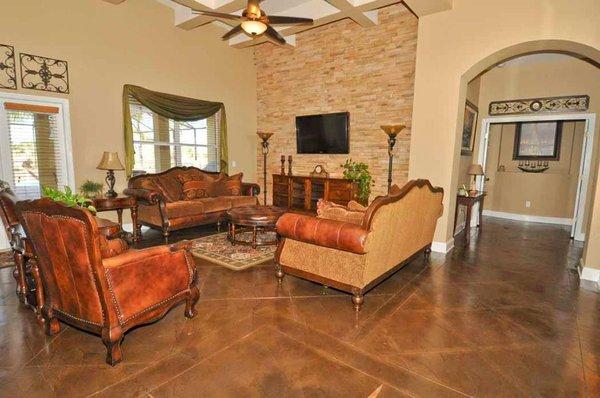 Who says you need expensive floor materials to achieve a luxurious look like this? Learn more about stained concrete interior floors!