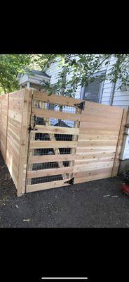 Horizontal 6ft Fence with custom built utility panel gate.