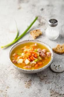 Gently simmered in a rich, flavorful clear broth that's been lovingly infused with aromatic herbs and spice and smoked meat