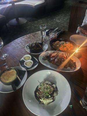 Braised Short Ribs, Rack of Lamb, lobster Linguine, Brussels Sprouts, Mashed Potatoes and signature sauce.