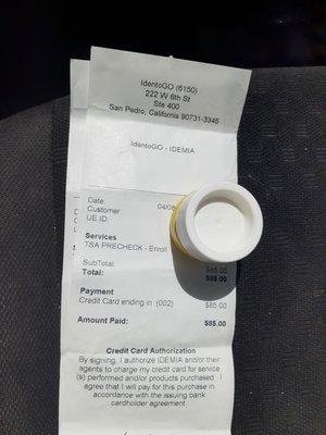 Receipt $85 for TSA precheck enrollment. Chapstick Covering up my info lol