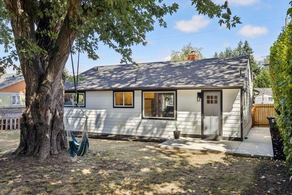 Back patio flower bed mulch and laurel trim
